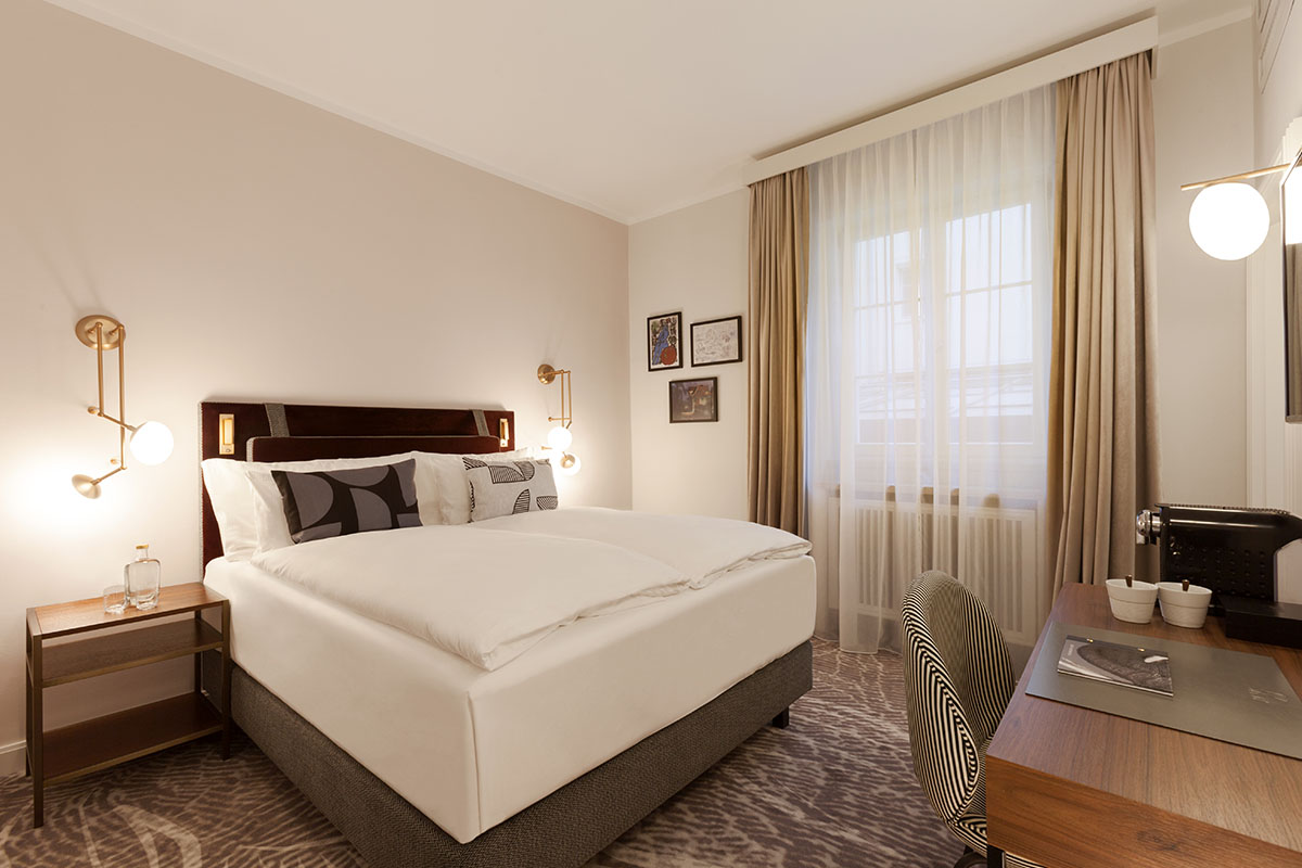 Classic room at Hotel Elephant with elegant design, comfortable bed and harmonious atmosphere for relaxation and inspiration.
